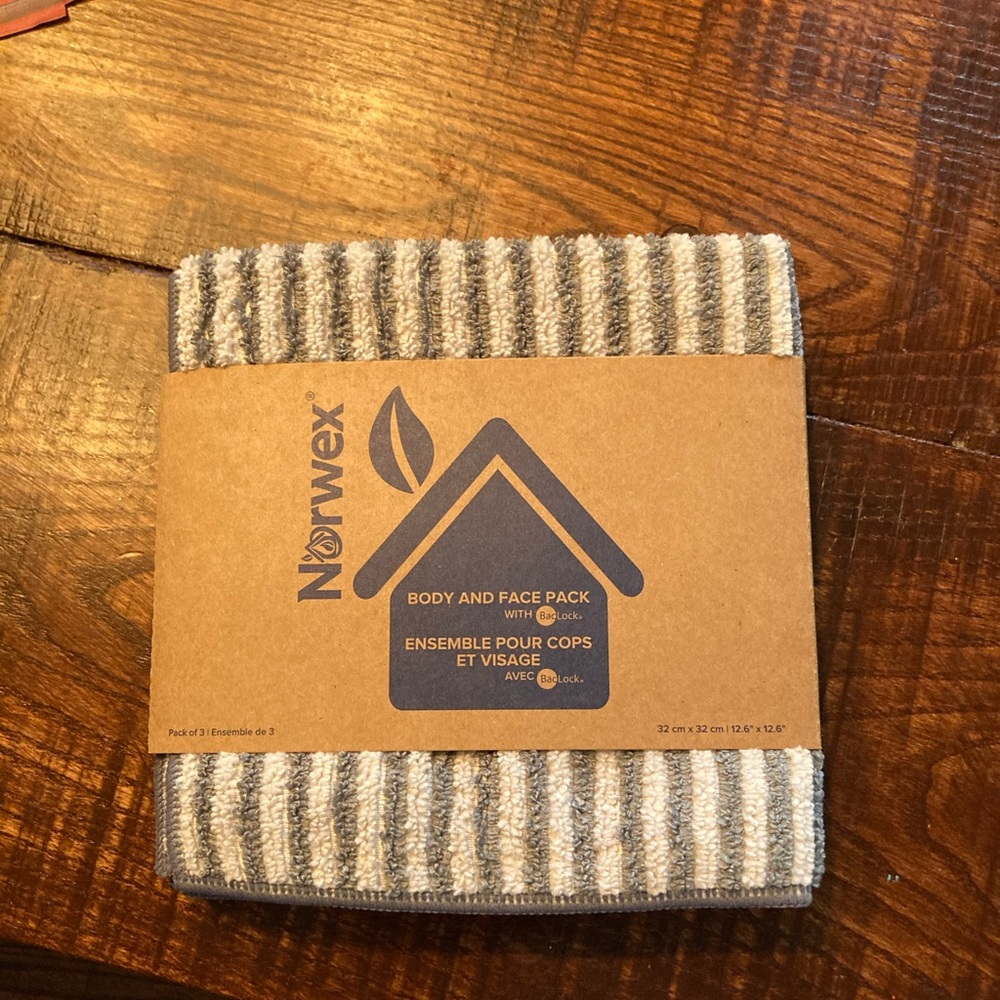 Brand new Norwex gray and white face and body pack